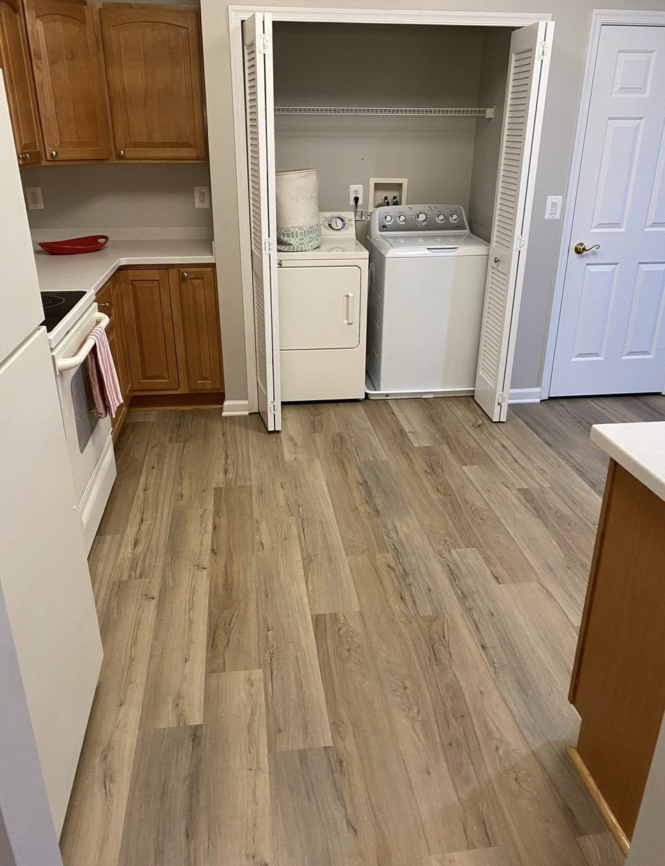 The same kitchen cleared, with new flooring, ready for sale